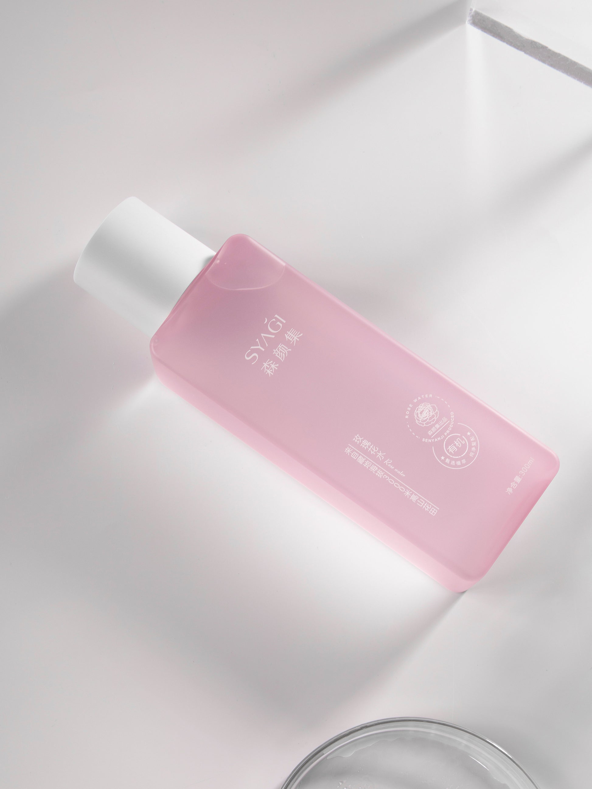 Temporary stock placeholder — embossed pink skincare bottle (via Pexels)